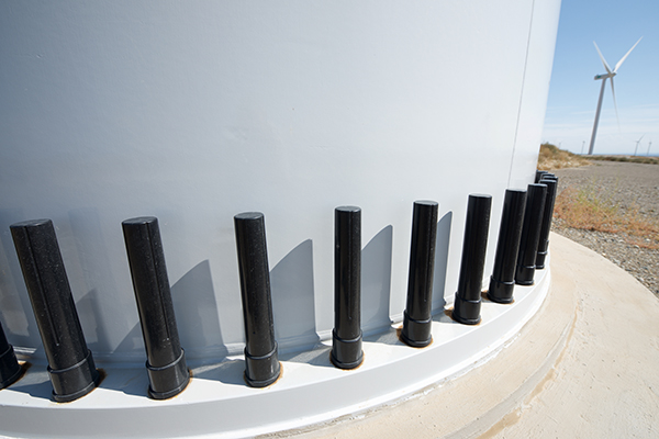 Close-up of the base of a wind turbine for electric power production.