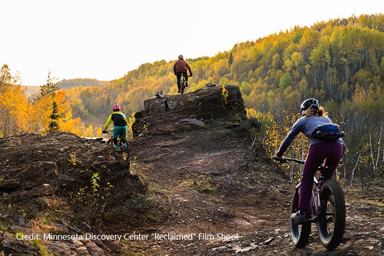 Cyclists riding the scenic trails at the Redhead Mountain Bike Park in reclaimed mine area.