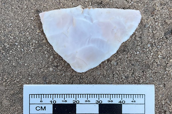 A fragment of chisled stone, referred to as a chert biface found during a cultural resources survey
